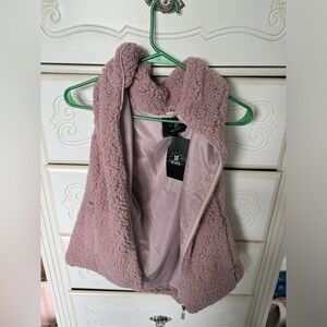 Brand new fluffy vest. Never worn new with tags. MEDIUM
